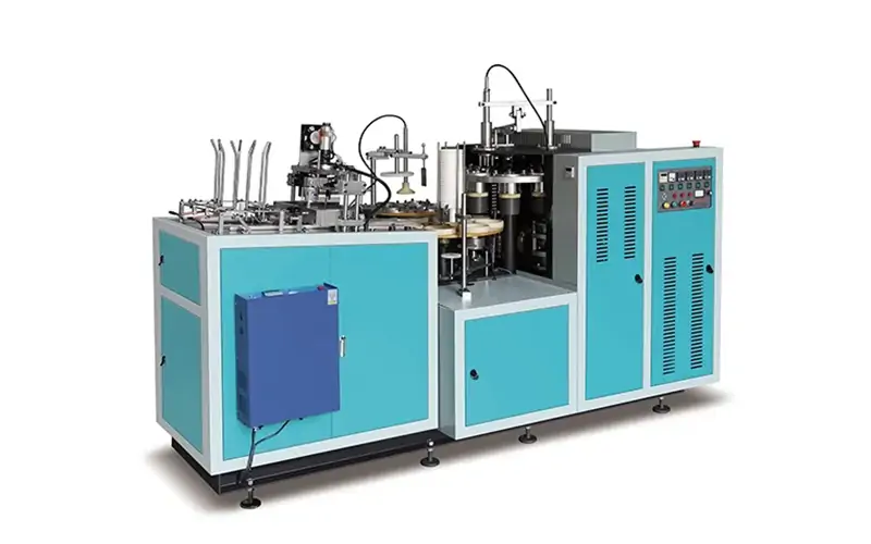 automated production line forming disposable food containers in a modern packaging factory